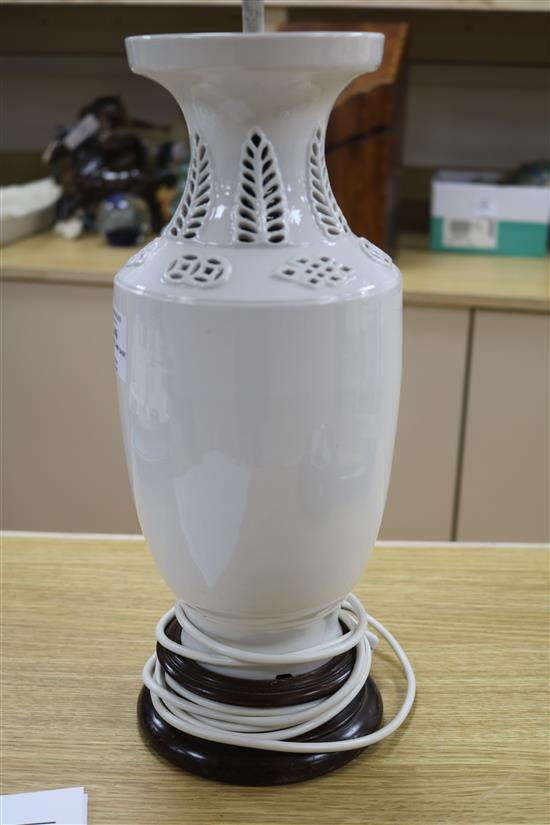 A Chinese figural whiteware lamp on wooden base